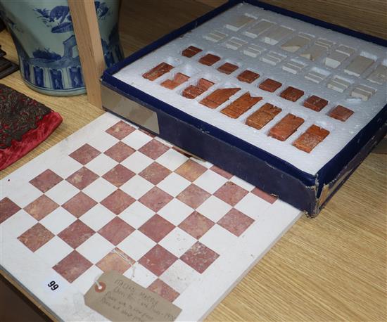 A marble chess board with pieces